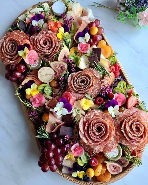 Floral charcuterie board with meat roses