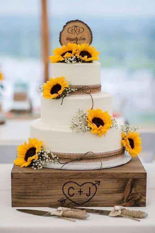 Plain cake with sunflowers and rustic decor