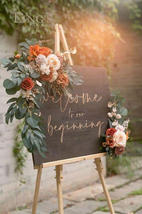 Welcome sign with greenery