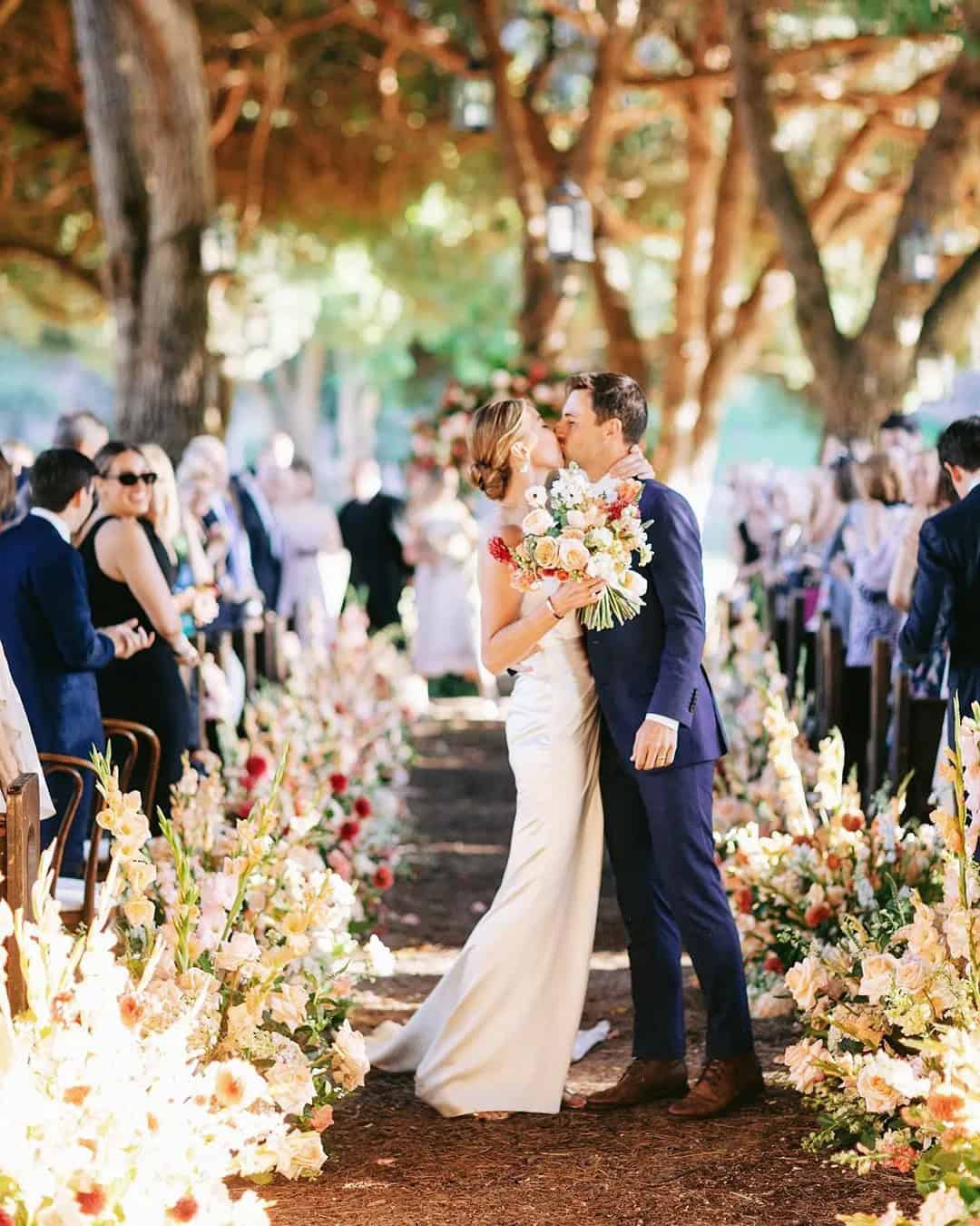 Wedding Kiss On A Background Of Happy Guests