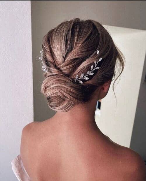 Low bun with crystal accessories