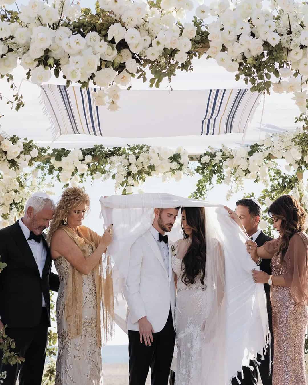 Bride and groom with both sets of parents