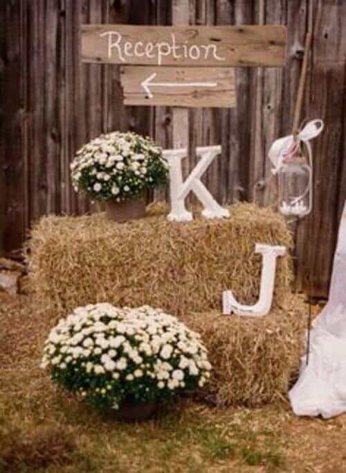 Wooden initial and barn decor for the reception sign