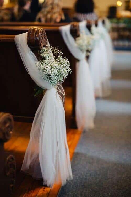 Fabric and baby’s breath aisle decor