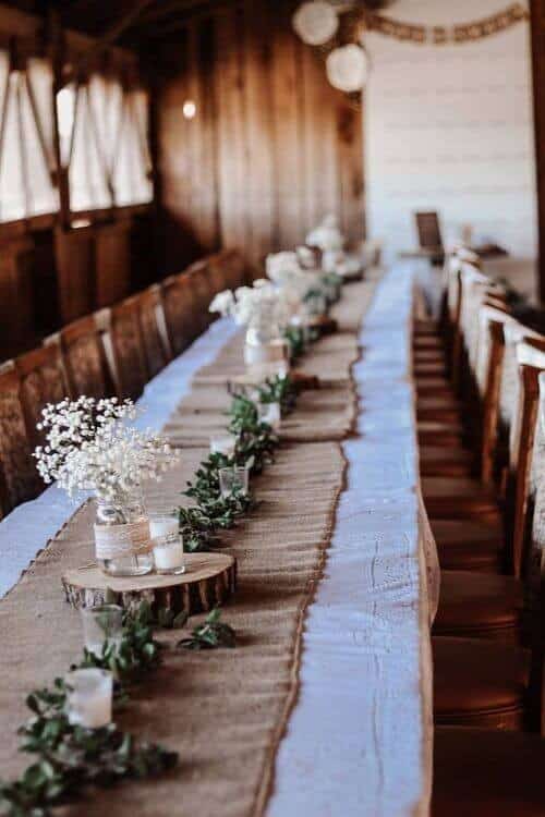 Burlap and greenery-filled centerpieces