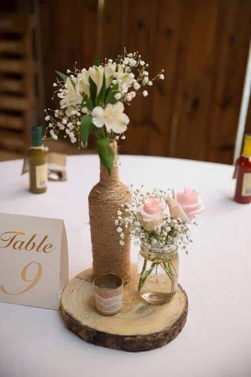 Twine-wrapped bottles and mason jars for roses