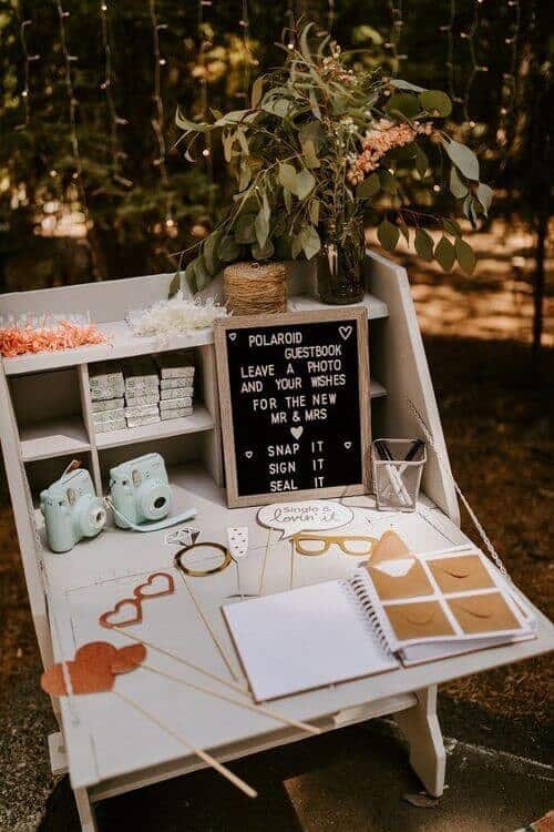 Scrapbook-style Guest Book Polaroid Booth with Photo Props