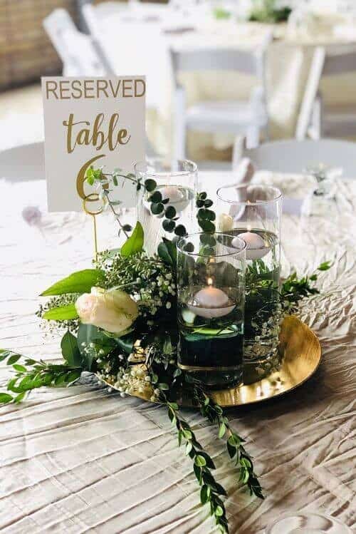 Gold and greenery table centerpieces