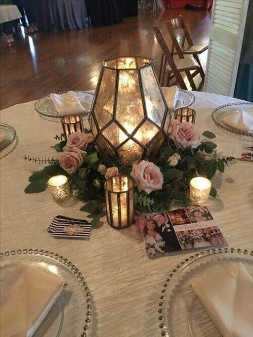 Lanterns in rose and greenery circles