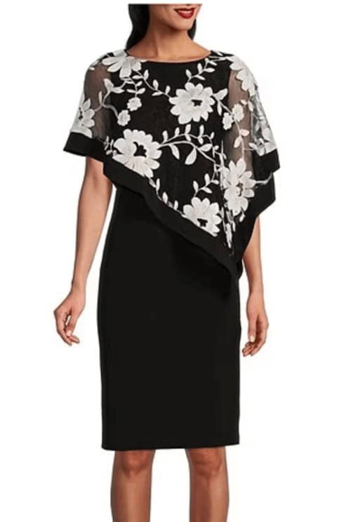 Sleek black dress with poncho overlay