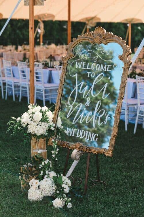 An outdoor mirror welcome sign