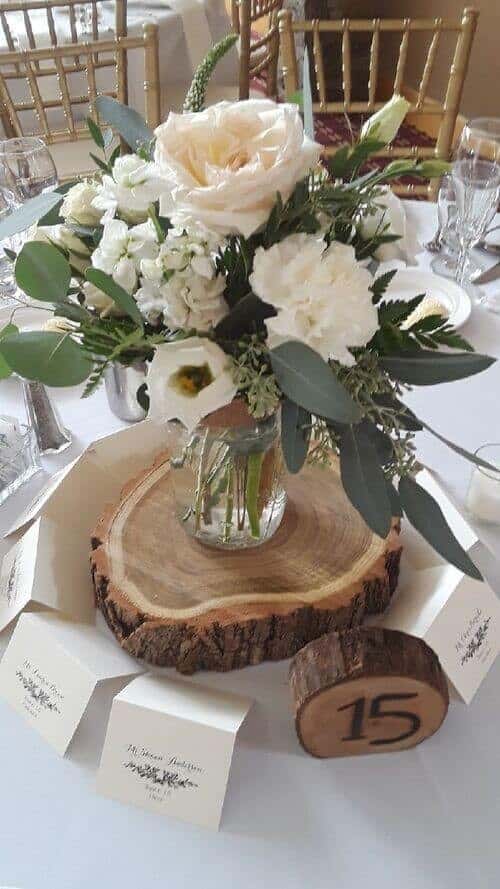 White roses and wood rounds