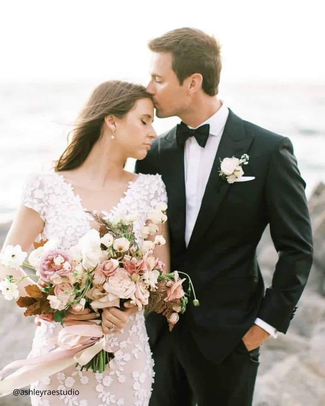 The Groom Kisses Bride’s Forehead Tenderly