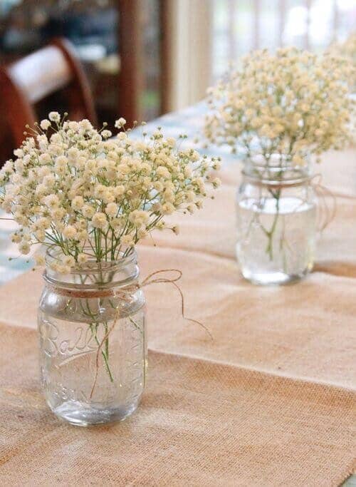 Twine strings wrapped around mason jars