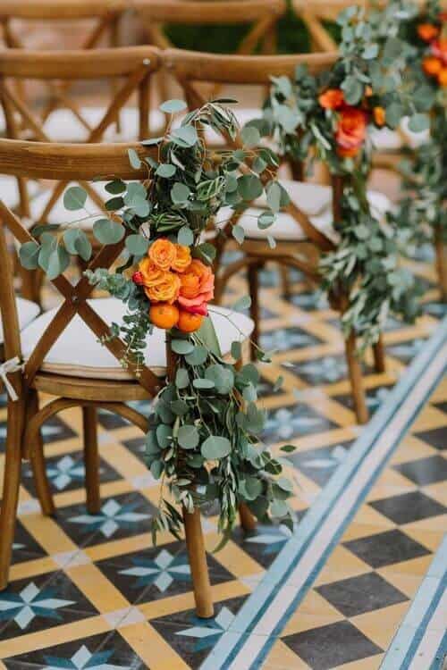 Eucalyptus and orange aisle decor