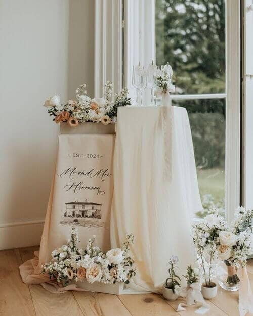 Florals, candles, and draped fabric