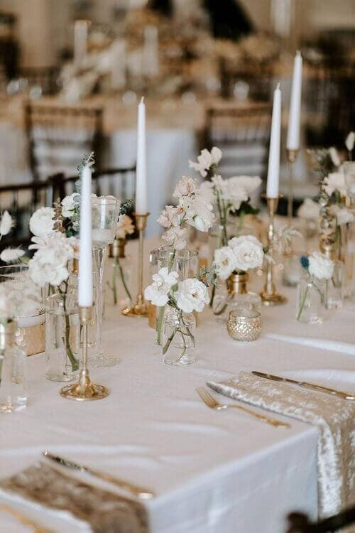 White blossoms in glass jars