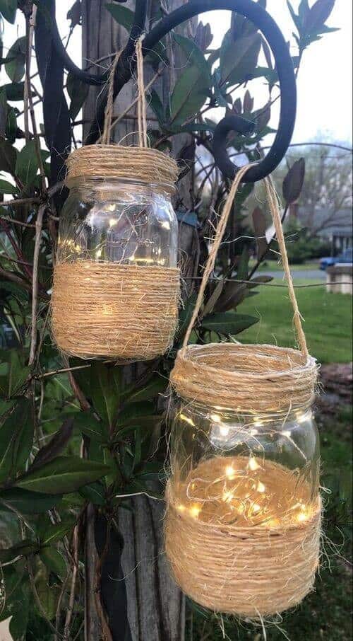 Twine-wrapped mason jars filled with fairy lights