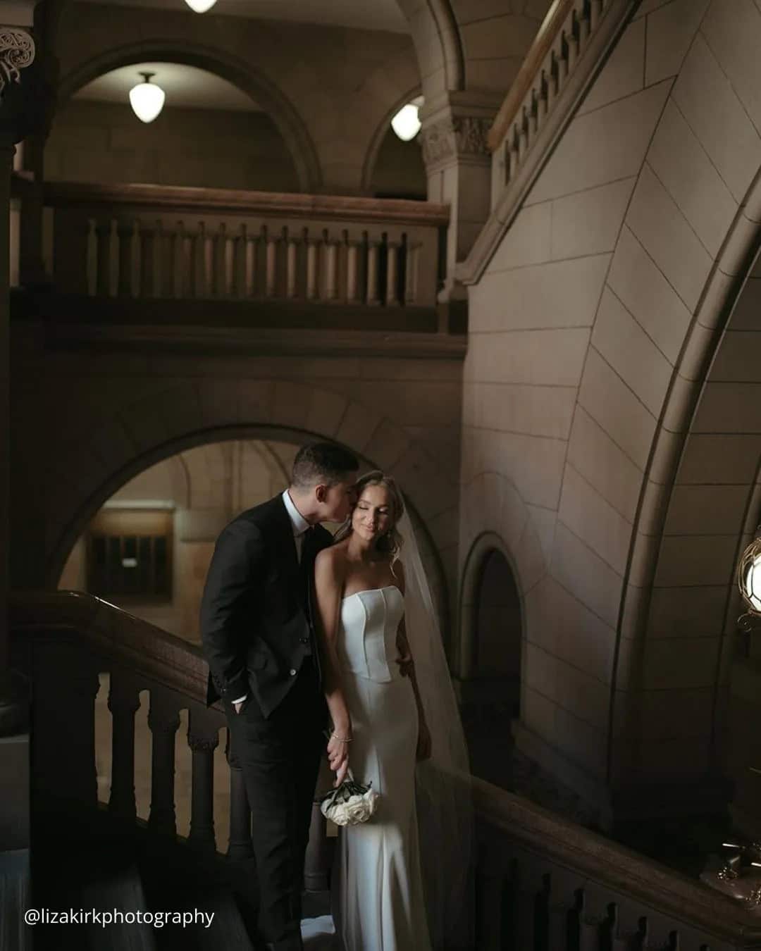 The Groom Kisses Bride’s Forehead Tenderly