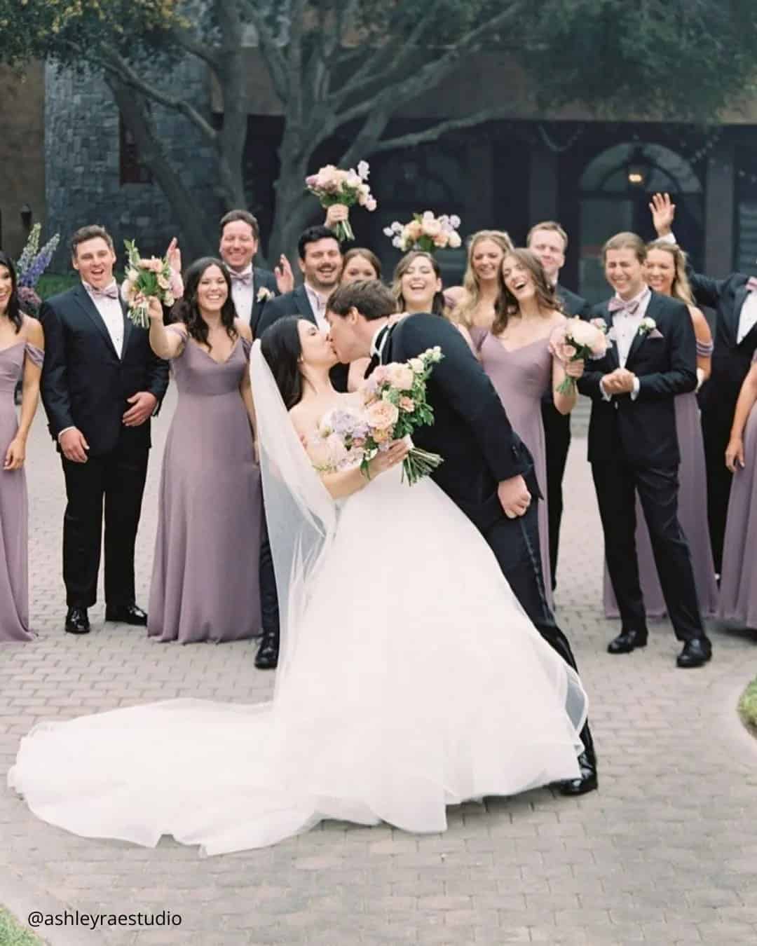 Wedding Kiss On A Background Of Happy Guests