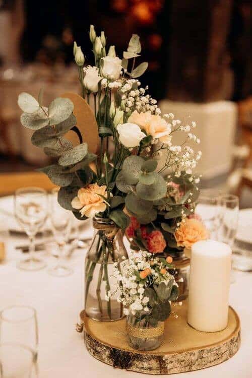 Eucalyptus and peach rose centerpieces