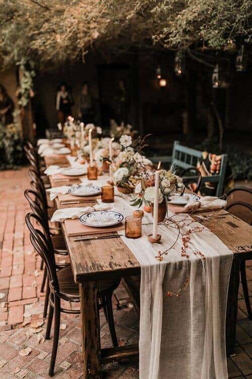 Vintage glasses, candles and fabric table runners