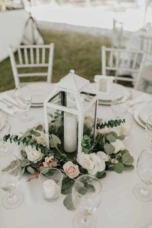 Green and white garlands with vintage white lanterns