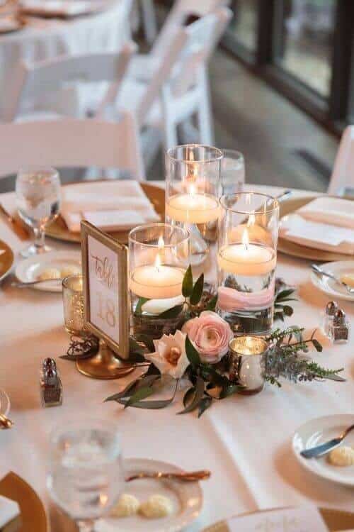 Floating tea lights and flower centerpieces