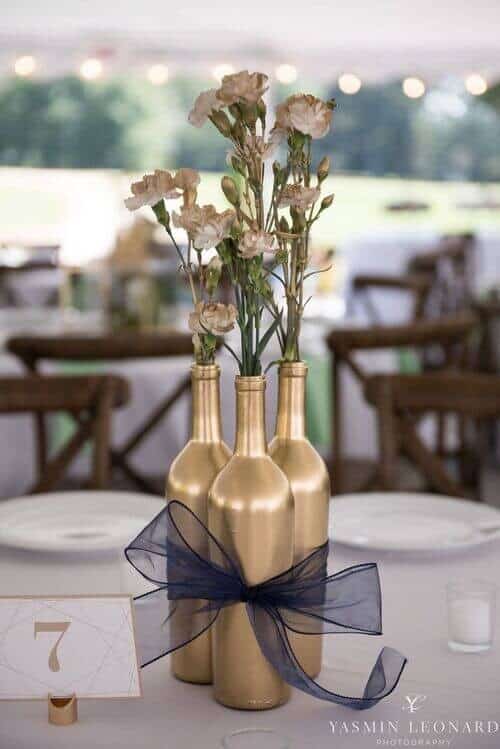 Gold-sprayed bottles filled with big roses