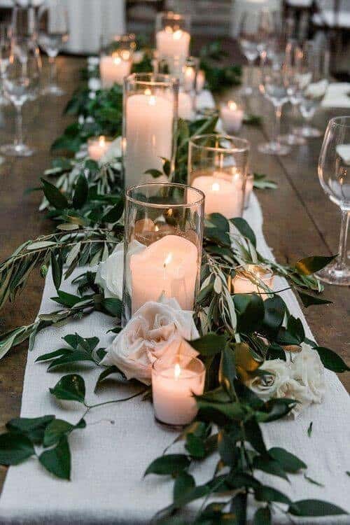 Candles and greenery table settings