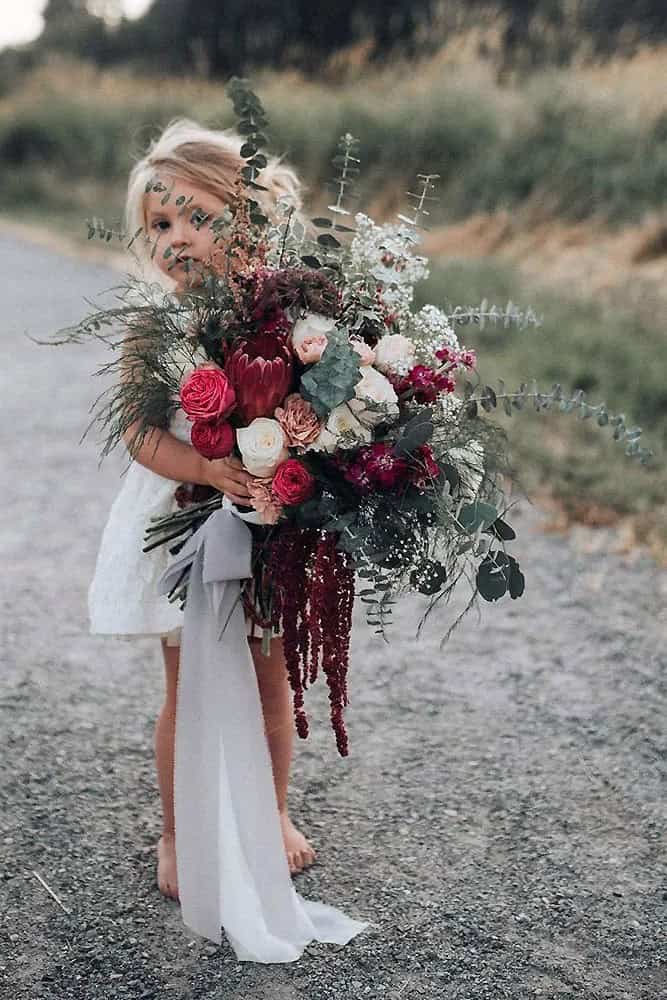 White And Burgundy Flowers In Greenery Bouquets