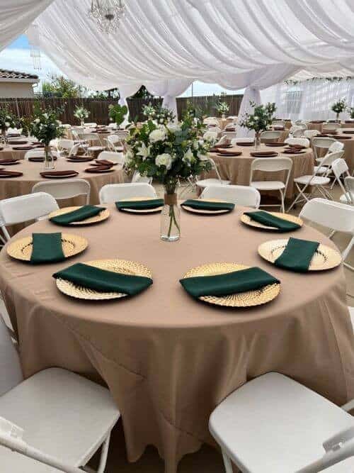 Beige, gold, and emerald place settings