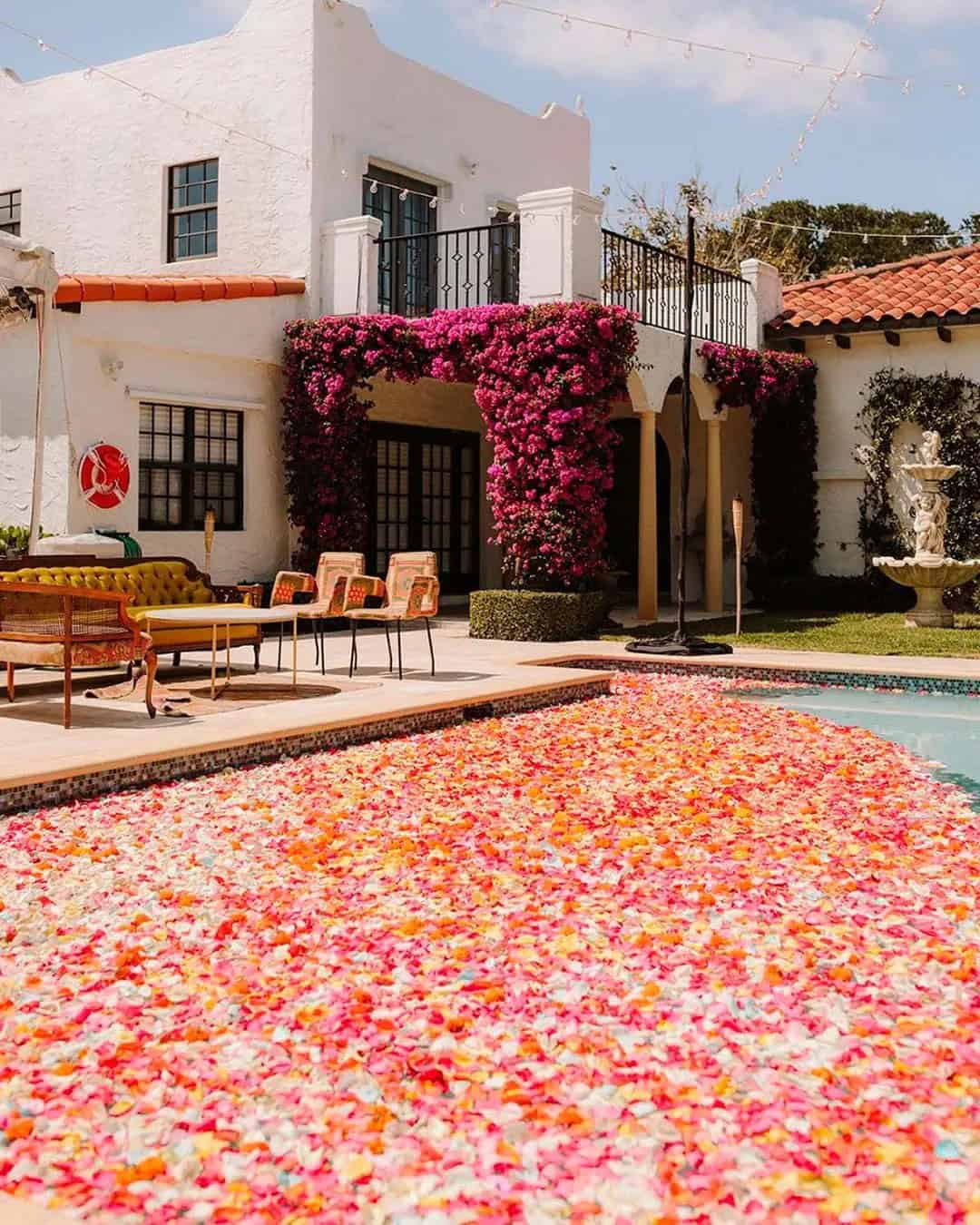 Swimming Pool Wedding Décor With Flower Petals and Flowers Floating