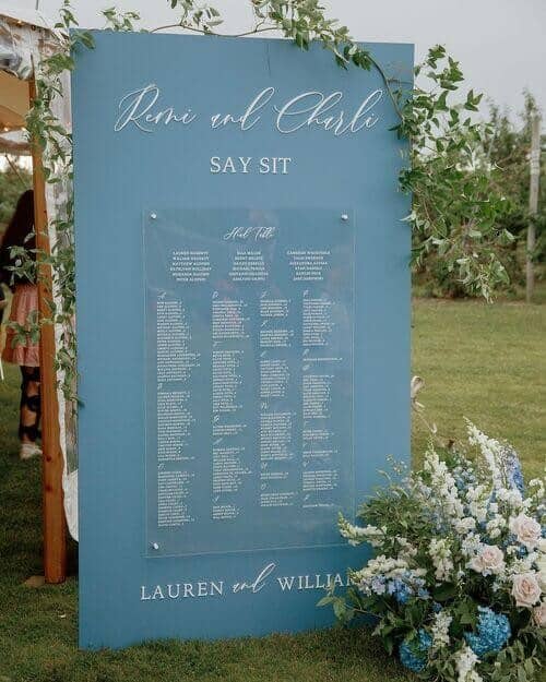 Outdoor wedding with acrylic signs