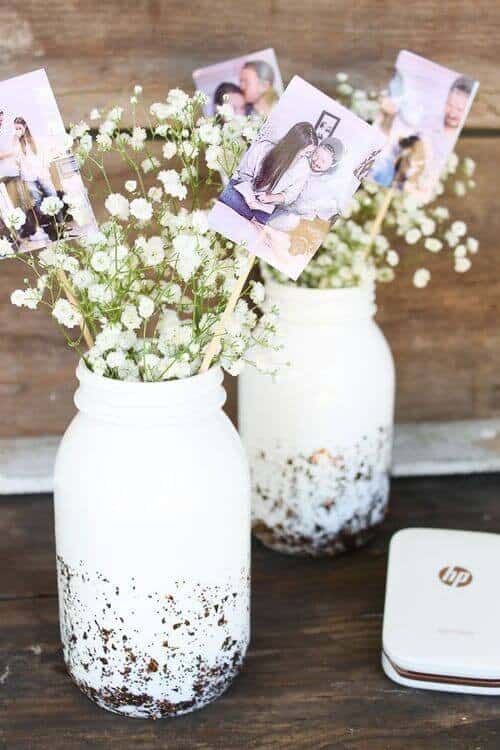 Twine and burlap-wrapped jars filled with flowers