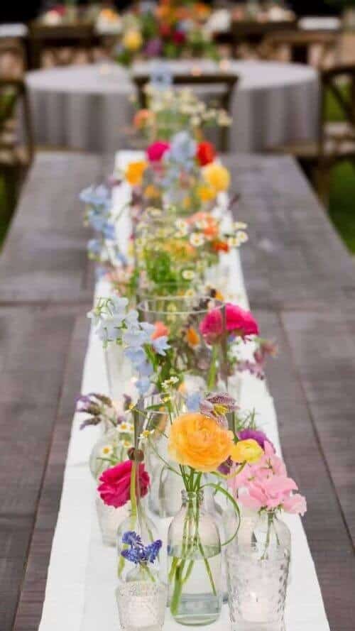 Minimalist glass and flower centerpieces