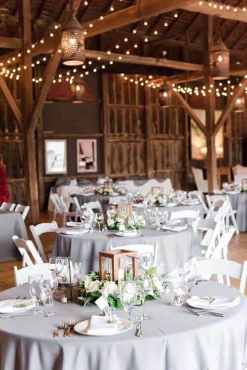 Sage tables and warm lighting