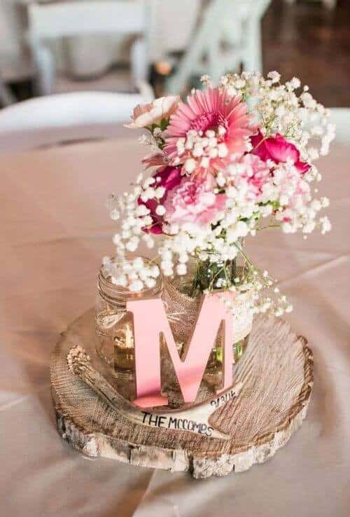 Pink and white centerpieces with initials