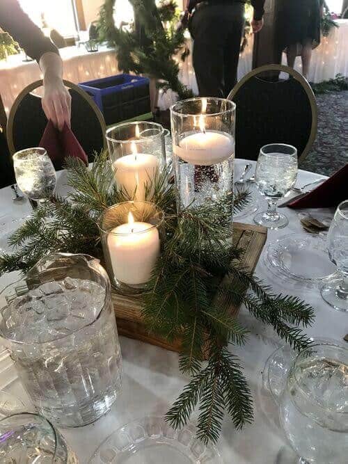 Wood trays with pine leaves and candles