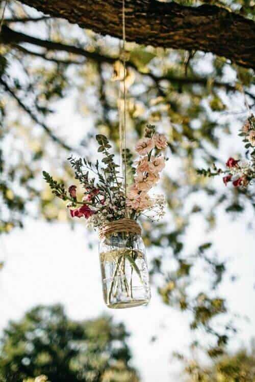 Hanging flowers in twine-tied mason jars