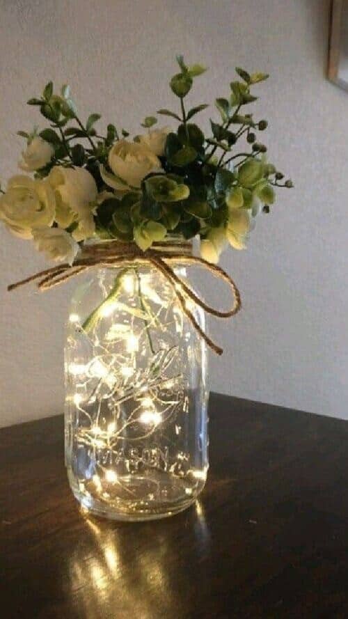 White flowers and fairy light mason jars