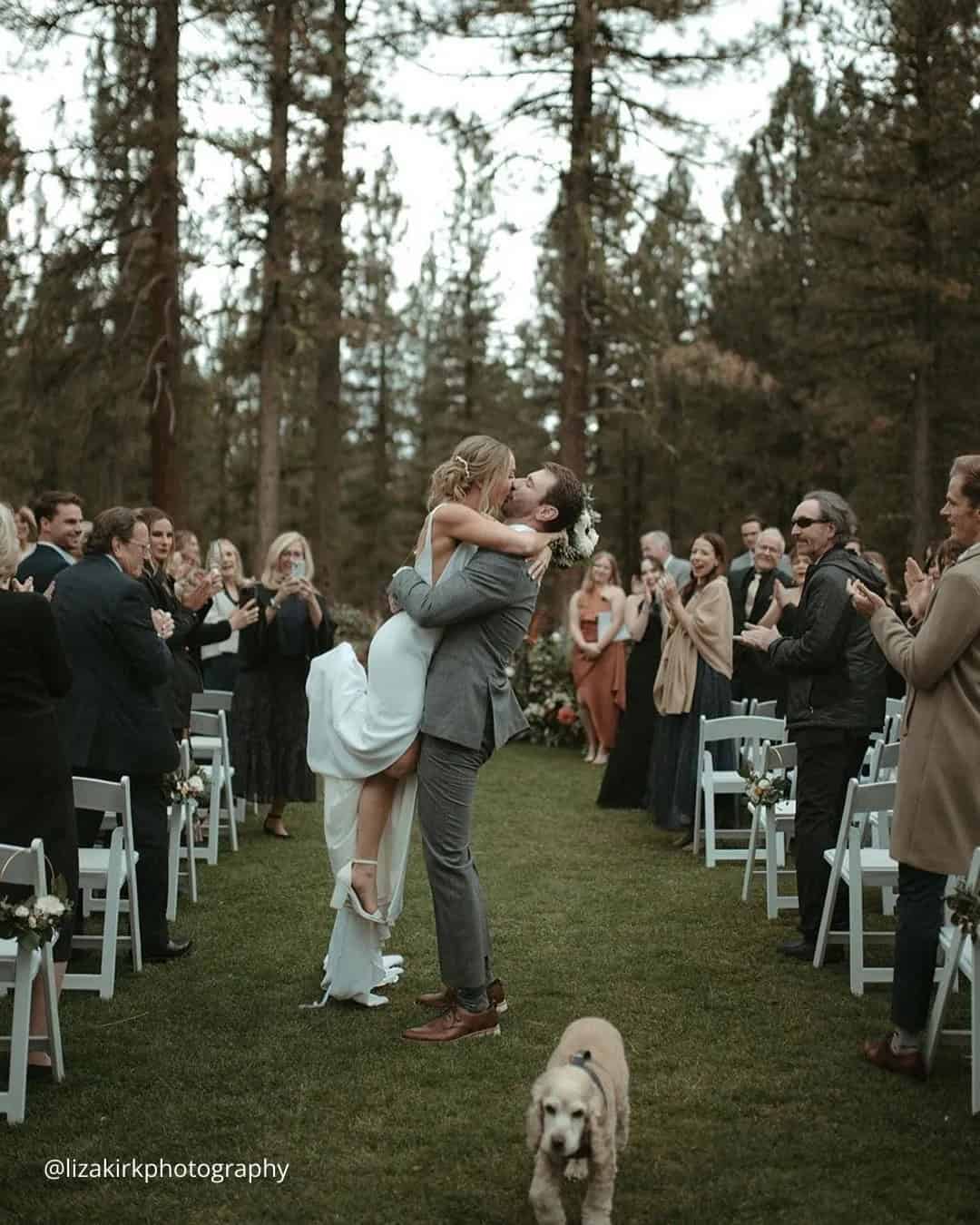 Wedding Kiss On A Background Of Happy Guests