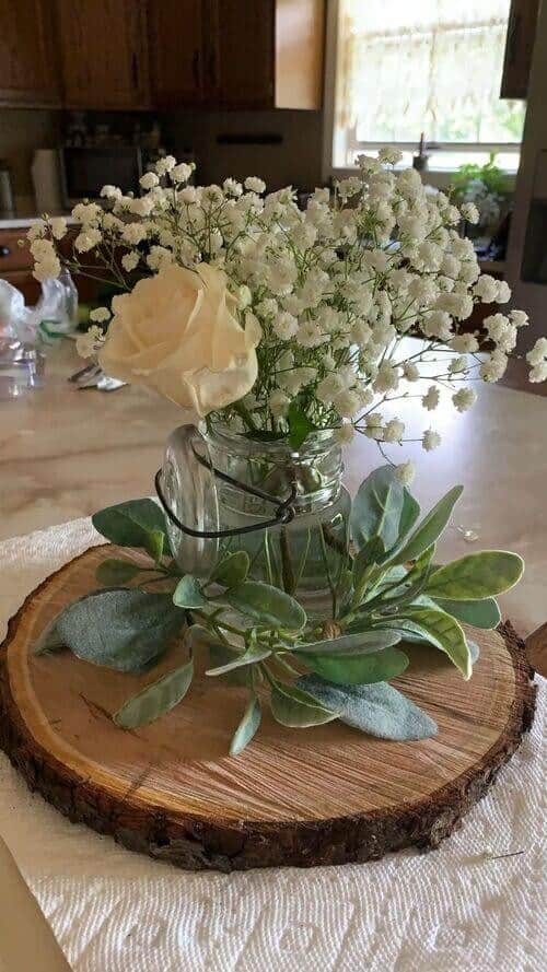 Baby’s breath and roses centerpiece