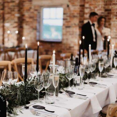 Black and white candles and foliage