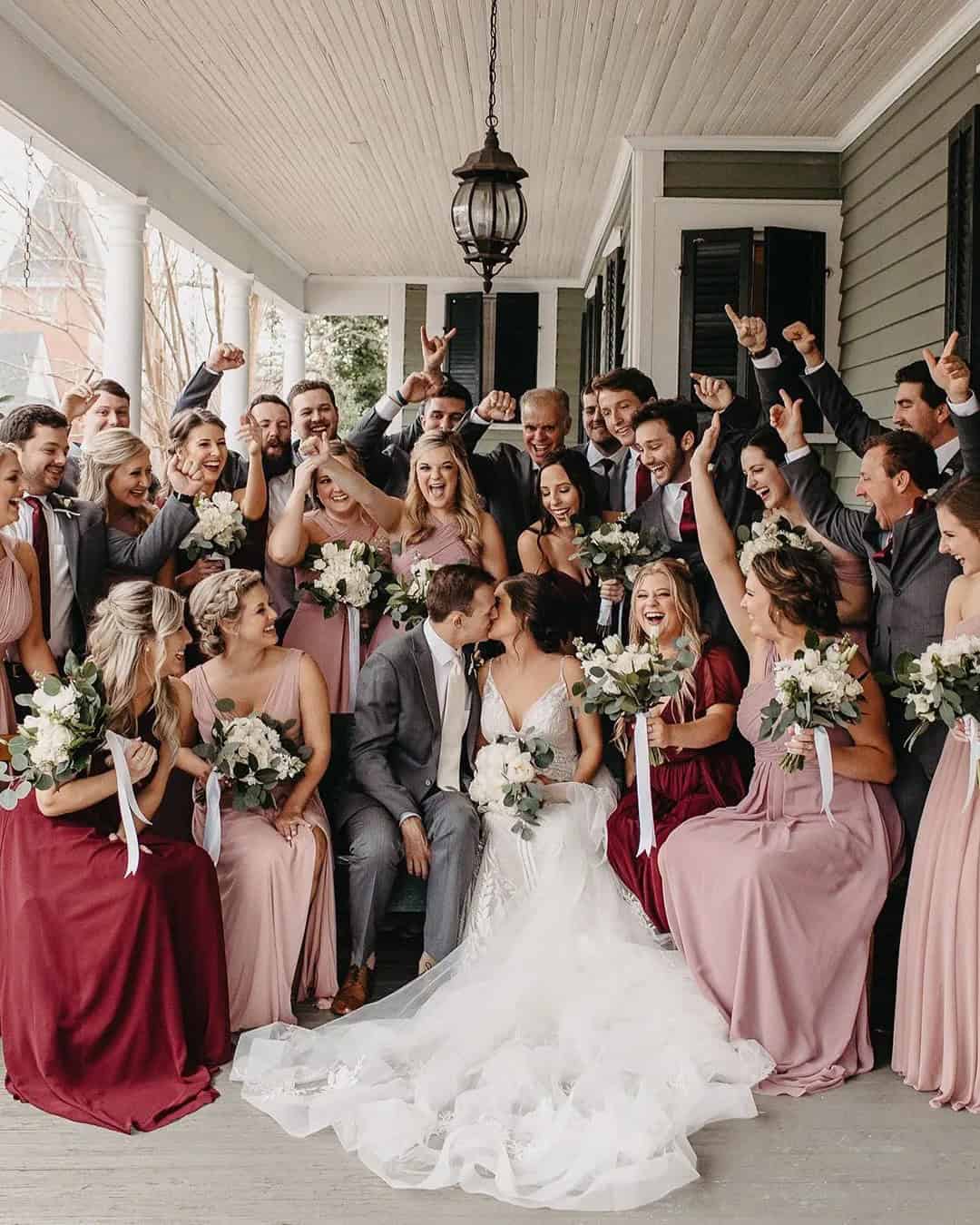 Wedding Kiss On A Background Of Happy Guests