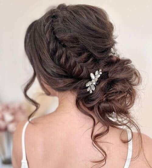 Side French Braid in a Low Curled Bun