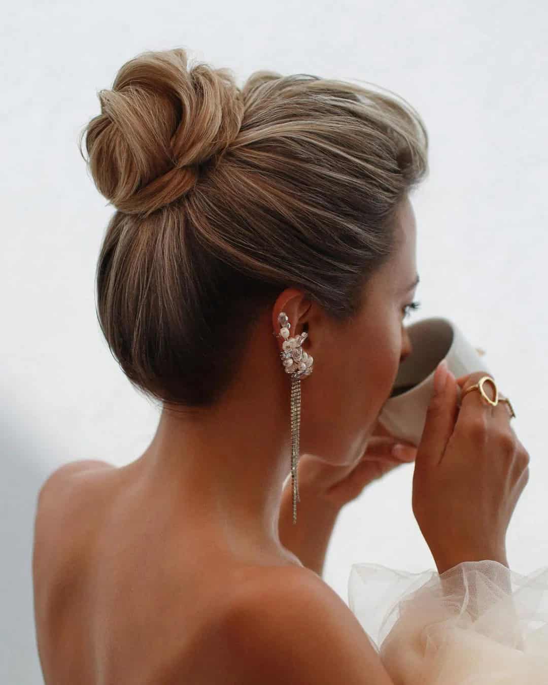 High Bun Swept-Back Hair