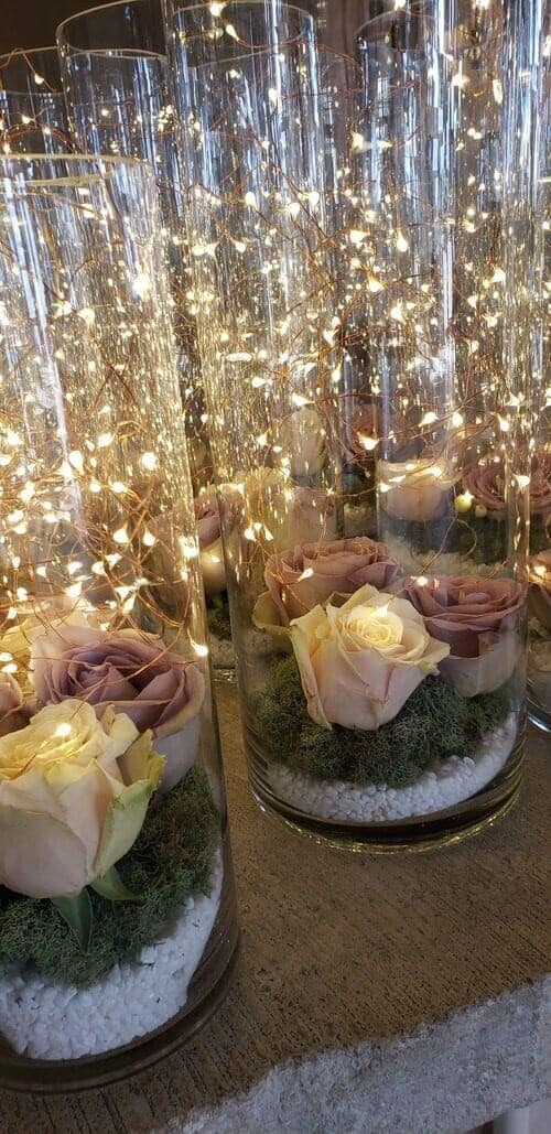 Fairy light and roses centerpieces