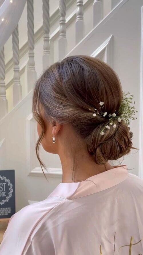 Simple bun with floral additions