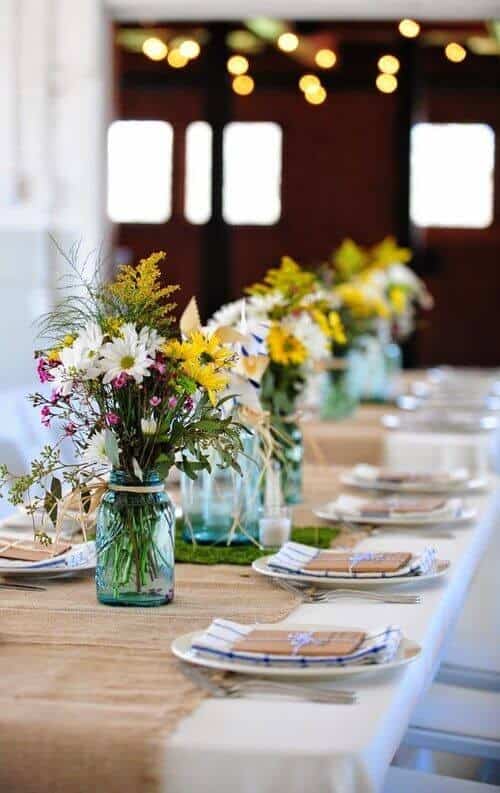 Tinted jars with wildflowers